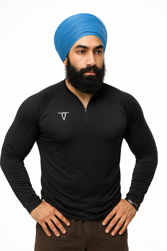 Man wearing a blue turban and black long-sleeve shirt with a logo on a white background